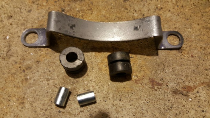 Fabricated muffler bracket with grommets